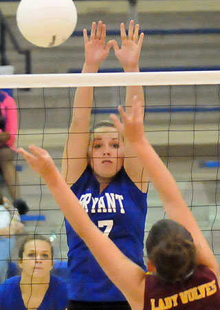 Cora Edwards reaches for a block. (Photo by Kevin Nagle)