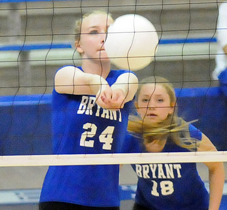 Camille Rawls (24) receives a serve in front of teammate Casey Welch. (Photo by Kevin Nagle)