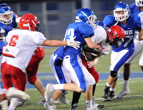 Tristan Sehika (43) leads the charge on a tackle. (Photo by Kevin Nagle)