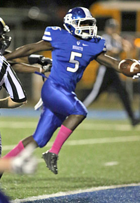 DeAmonte Terry reaches across the goal line as he completes his 19-yard touchdown run in the first half. (Photo by Rick Nation)